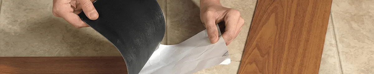 A professional installing vinyl flooring in Madison, WI